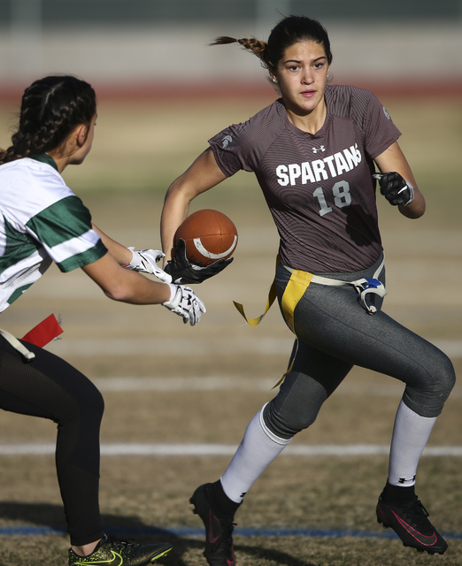 Cimarron-Memorial's Haylie Hughes (18) runs the ball past Palo Verde's Gianni Terrana (42) during the Sunset Region flag football championship game at Green Valley High School in Henderson on Tues ...