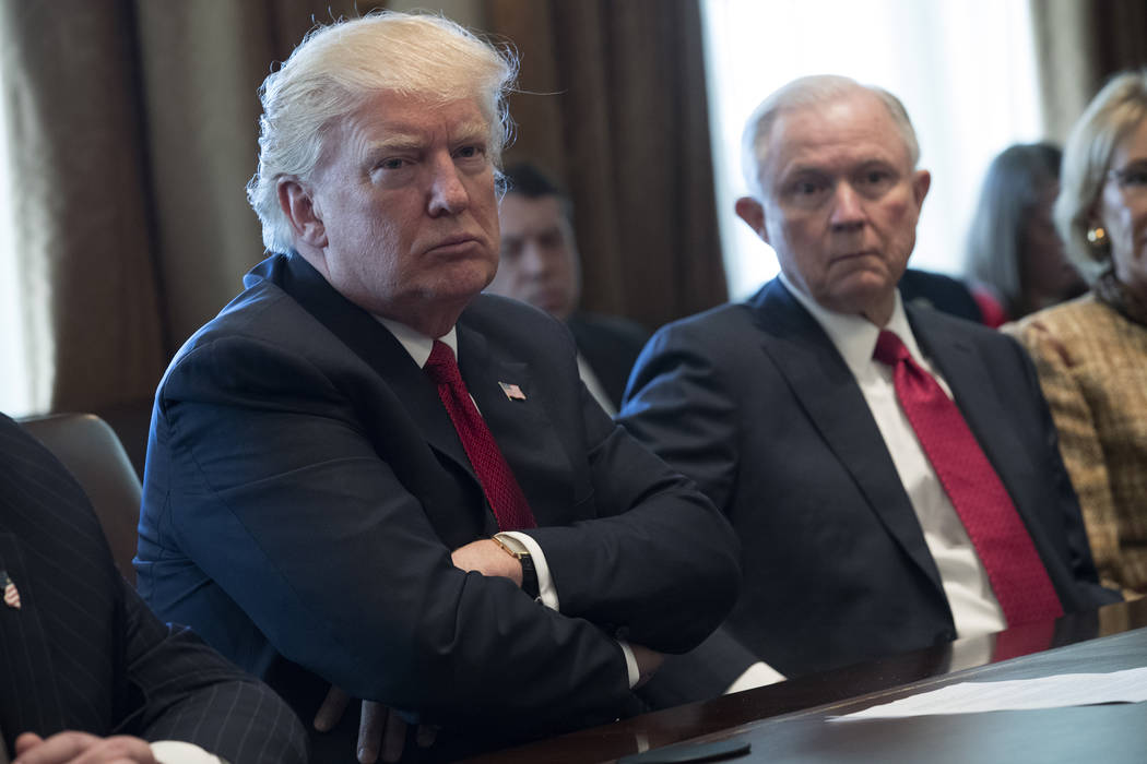 President Donald J. Trump, with Attorney General Jeff Sessions, delivers remarks during an opioid and drug abuse listening session at the White House in Washington in March. (Shawn Thew/Pool via C ...