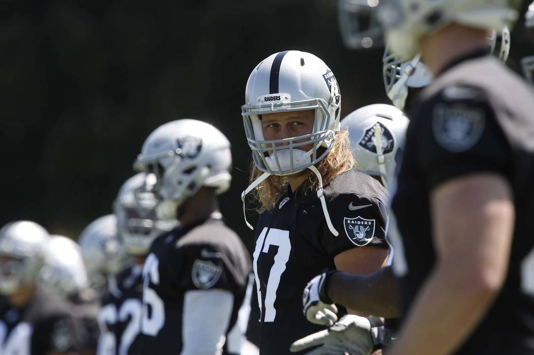 The Oakland Raiders defensive end/linebacker James Cowser, second left, during the second day of teams practice at Raiders Napa Valley training complex in Napa., Calif., on Sunday, July 30, 2017.  ...