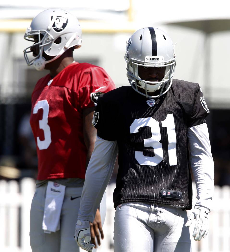 The Oakland Raiders backup quarterback Ej Manuel (3) and cornerback Breon Borders (31) walk off the field during the second day of teams practice at Raiders Napa Valley training complex in Napa.,  ...
