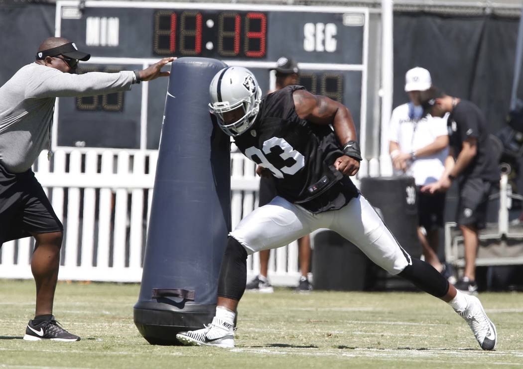 The Oakland Raiders defensive end Jimmy Bean hits the tackling dummy during the second day of teams practice at Raiders Napa Valley training complex in Napa., Calif., on Sunday, July 30, 2017. Biz ...