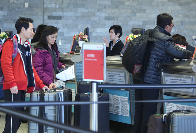 Passengers check-in for their flight at the Hainan Airlines ticket counter on Monday, Feb. 27, 2017 at McCarran International Airport in Las Vegas. (Bizuayehu Tesfaye/Las Vegas Review-Journal) @bi ...