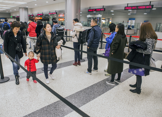 Passengers from a Hainan Airlines flight from Beijing wait to clear customs at McCarran International Airport on Wednesday, Jan. 11, 2017. (Jeff Scheid/Las Vegas Review-Journal) @jeffscheid