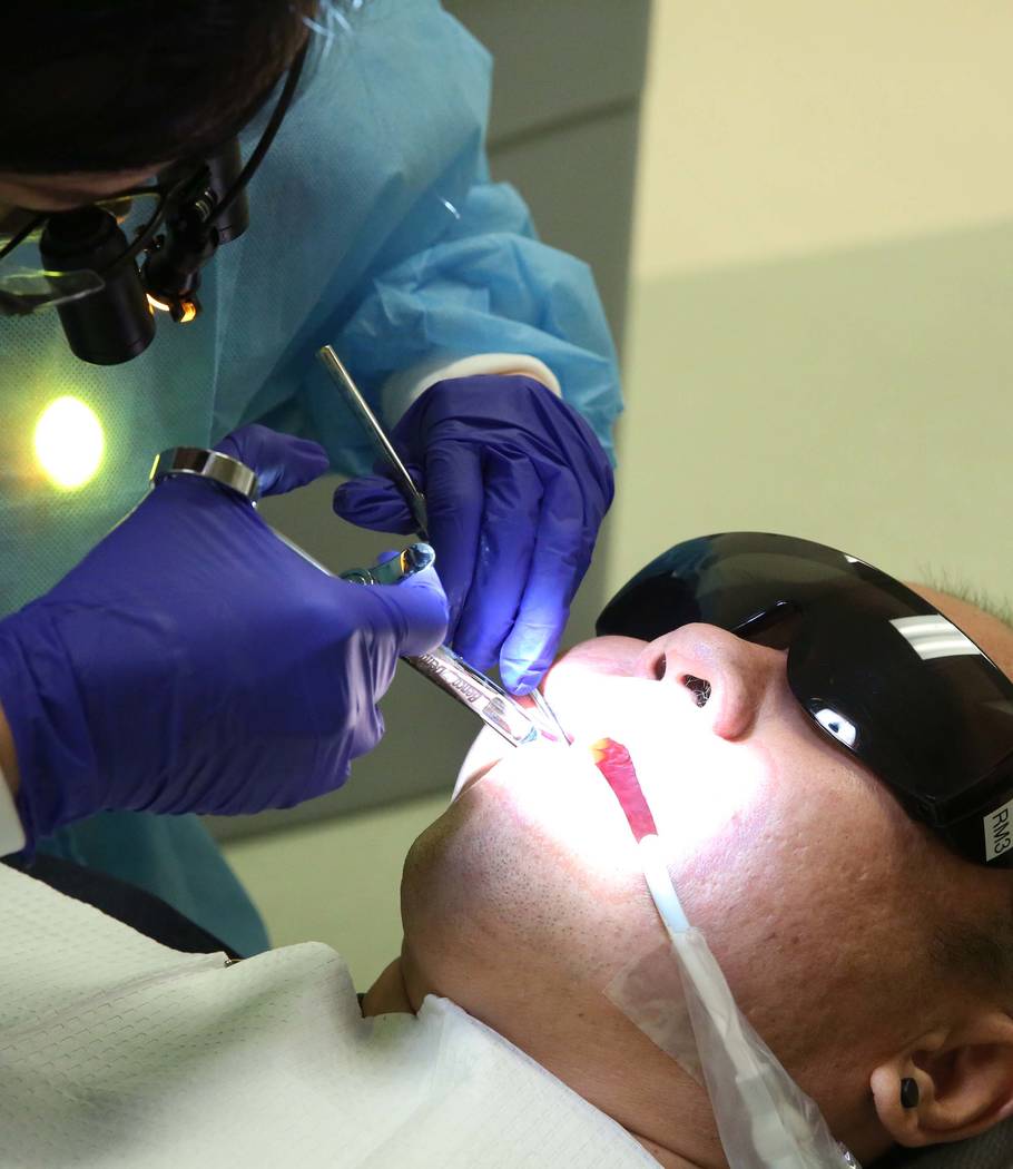 UNLV School of Dental volunteer student treats Nelson Tang, at Volunteers In Medicine of Southern Nevada on Monday, July 24, 2017, in Las Vegas. (Bizuayehu Tesfaye/Las Vegas Review-Journal) @bizut ...
