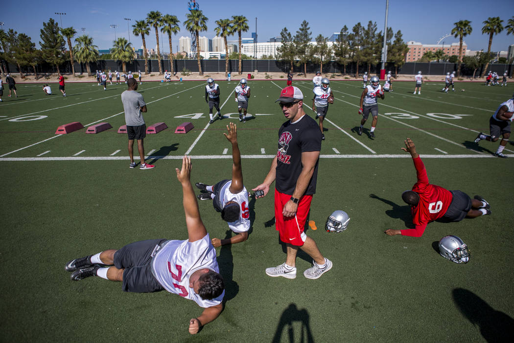 UNLV training and conditioning intern Joe Sisson works with players during the first day of training camp at Rebel Park on Wednesday, August 2, 2017. Patrick Connolly Las Vegas Review-Journal @PC ...