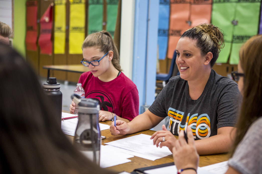 Lindsay Powers, student council advisor, smiles while going over agenda items with student council members including Daniela Cassidy, left, first vice president, at Bonanza High School on Monday,  ...