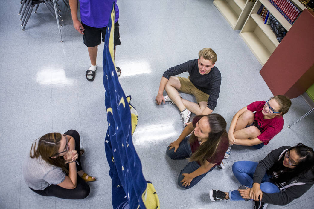 (from left) Student Council members Devon Neary, Justin Balconi (in purple), Chris Douglas, Maya Duckworth, Daniela Cassidy (in red), and Angela Lin play an icebreaker game in preparation for an u ...