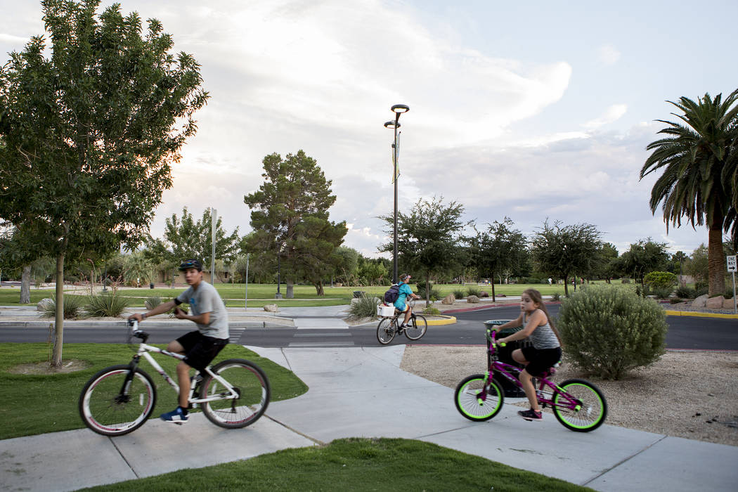 Visitors bike through Sunset Park in Las Vegas on Tuesday, Aug. 1, 2017. Bridget Bennett Las Vegas Review-Journal @bridgetkbennett