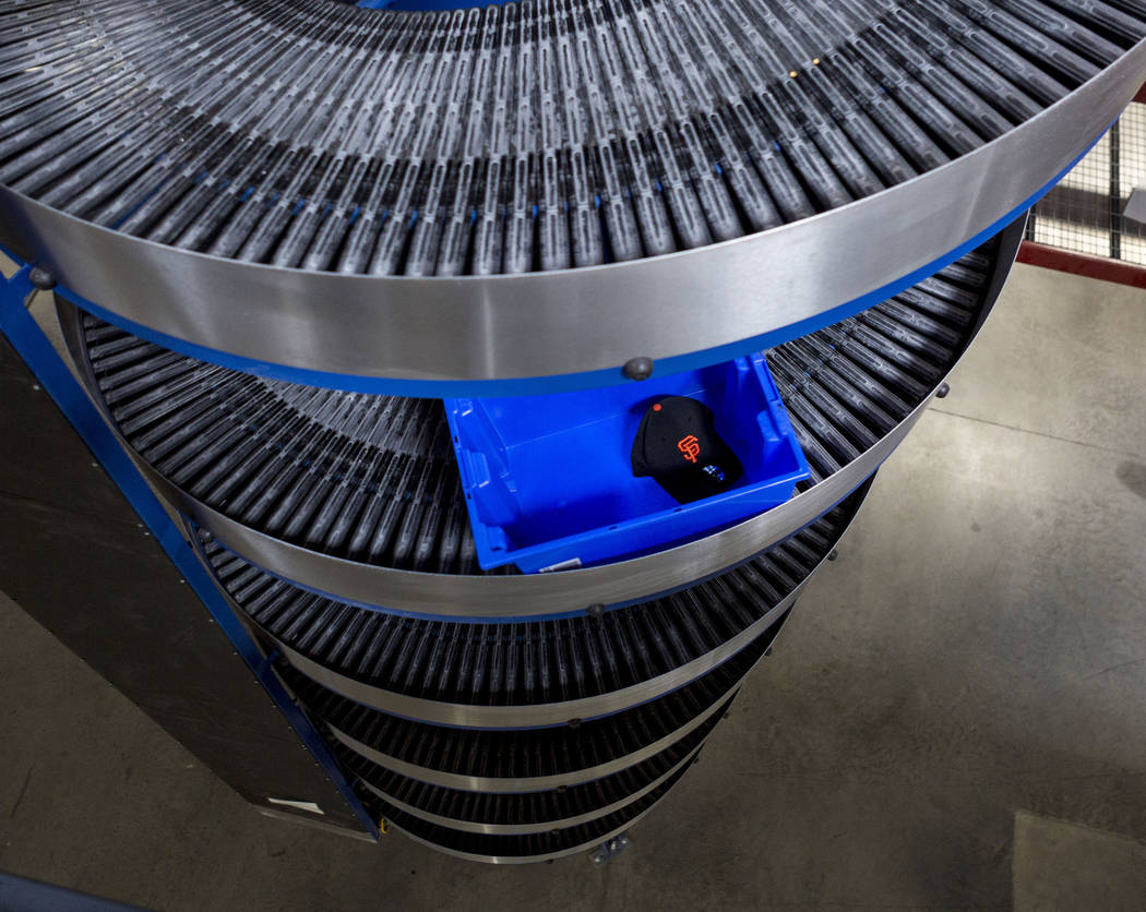 An athletic team logo hat on a conveyor belt at the Fanatics distribution center in North Las Vegas, Wednesday, Aug. 16, 2017. (Elizabeth Brumley/Las Vegas Review-Journal)