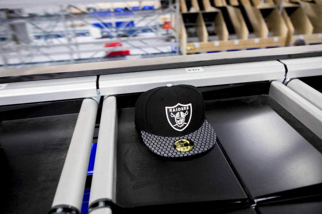An athletic logo hat on a conveyer belt at the Fanatics distribution center in North Las Vegas, Wednesday, Aug. 16, 2017. (Elizabeth Brumley/Las Vegas Review-Journal)