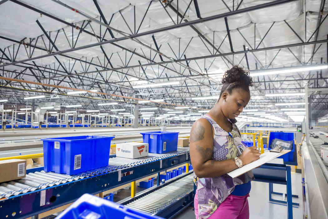 Shipping lead Olivia McCantis takes inventory at the Fanatics distribution center in North Las Vegas, Wednesday, Aug. 16, 2017. (Elizabeth Brumley/Las Vegas Review-Journal)