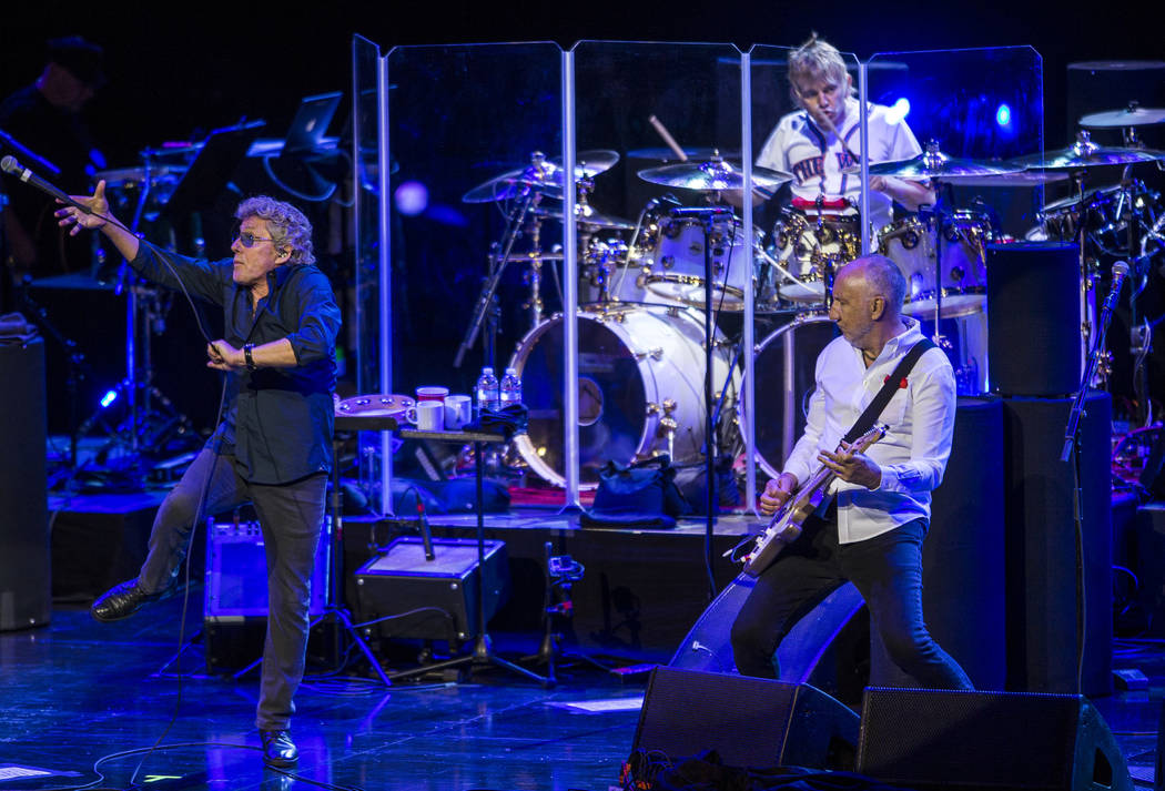Roger Daltrey attempts to catch the microphone while guitarist Pete Townshend watches while The Who performs at the Colosseum at Caesars Palace on Saturday, July 29, 2017.  Patrick Connolly Las Ve ...