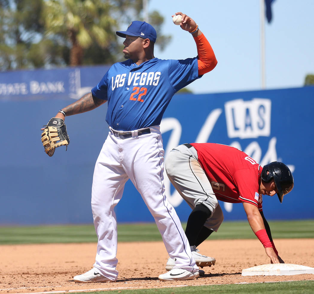 Las Vegas 51s Dominic Smith throws the ball after Albuquerque Isotopes Daniel Castro gets safely to first base at Cashman Field in Las Vegas, Sunday, April 30, 2017. Elizabeth Brumley Las Vegas Re ...
