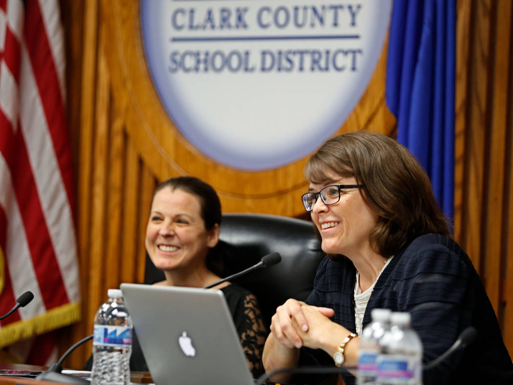 Erin Cranor, left, a member of the Clark County School Board, District G, center, right, speaks during her last meeting as a board member at Edward Greer Education Center in Las Vegas, Thursday, A ...