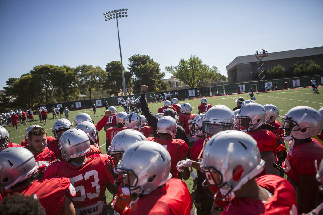 The UNLV defense comes together for a huddle during training camp at Rebel Park on Monday, Aug. 14, 2017.  Patrick Connolly Las Vegas Review-Journal @PConnPie