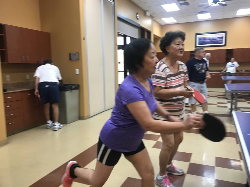 From left, Xiaoli Huang, 70, and Rosalind Wu, 76, play ping pong on July 3, 2017 at Sun City Aliante community center, 7390 N. Aliante Parkway. (Kailyn Brown/ View) @KailynHype