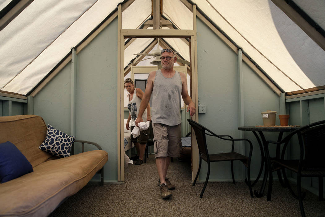 Laura Cavaness, left, and Carl Cavaness clean out a lodge at the Hotel Nipton, Thursday, Aug. 3, 2017, in Nipton, Calif. American Green Inc., one of the nation's largest cannabis companies, announ ...