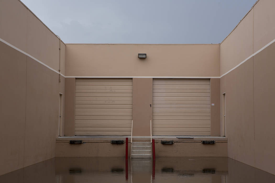 Water fills an loading area of a business on South Highland Drive, just north of Rio hotel-casino after rainfall on Friday, Aug. 4, 2017, in Las Vegas. Bridget Bennett Las Vegas Review-Journal @br ...