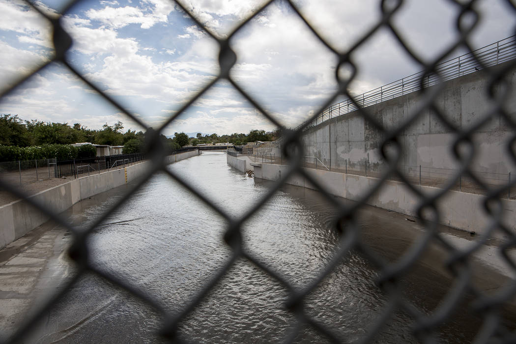 Water flows down a wash near the intersection of East Sahara Avenue and Boulder Highway after rainfall on Friday, Aug. 4, 2017, in Las Vegas. Bridget Bennett Las Vegas Review-Journal @bridgetkbennett