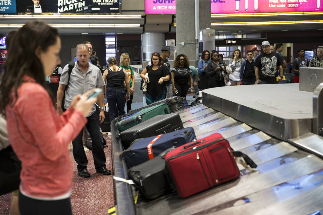 Spirit passengers wait for their luggage at McCarran International Airport in Las Vegas on Wednesday, Aug. 9, 2017. Erik Verduzco Las Vegas Review-Journal @Erik_Verduzco
