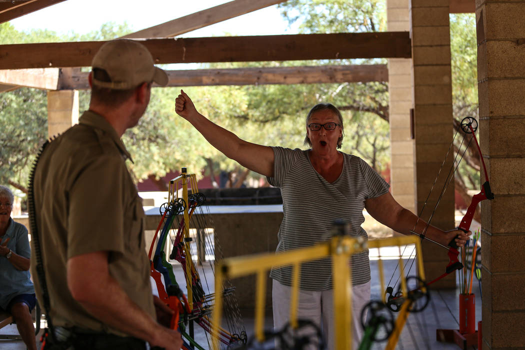 Edie Duncan cheers after a shooting an arrow on target during an archery target shooting program at Spring Mountain Ranch State Park near Blue Diamond on Aug. 25, 2017. Joel Angel Juarez Las Vegas ...