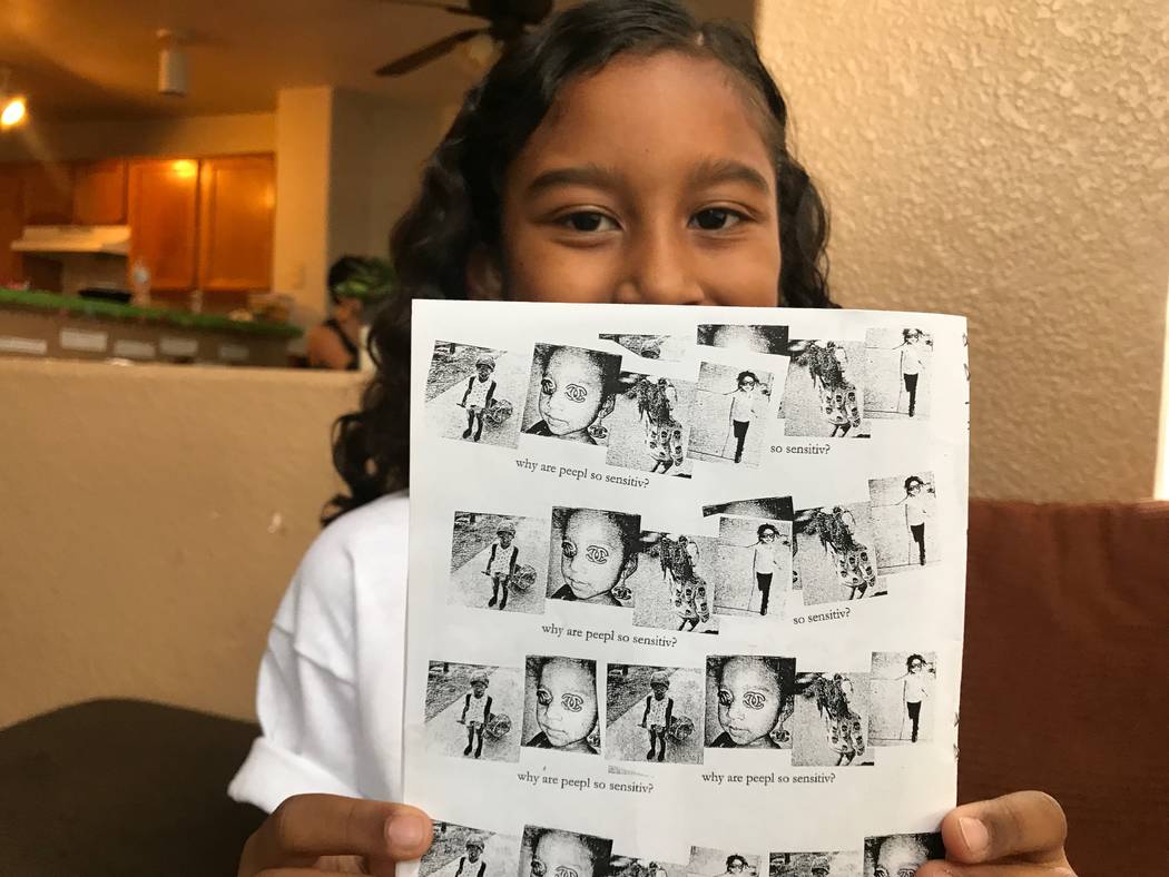 Kumei Norwood, 9, holding up one of her zines on Aug. 6, 2017 in her North Las Vegas home. (Kailyn Brown/ View) @KailynHype