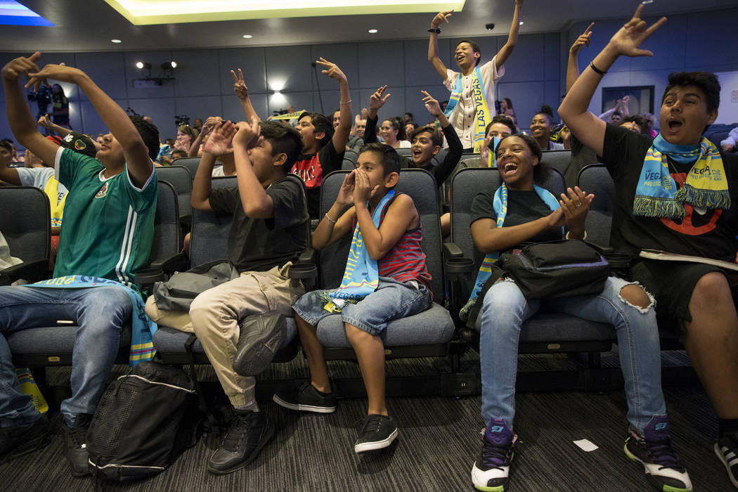Children with the Boys & Girls Clubs of Southern Nevada from left, Christopher Ramirez, 13, Mark Cortez, 12, Samuel Seoane, 11, Amiyah Jordan, 14, and Sebastian Manzo, 15, cheer during an Unit ...