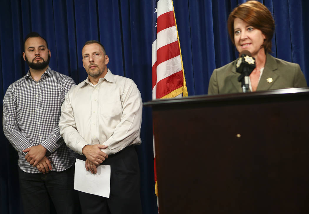 Freddy Lopez, a family friend, left, and Paul Meadows, godfather of Makayla Rhiner, who was killed Thursday, are introduced by Las Vegas police officer Laura Meltzer before a statement at Metropol ...