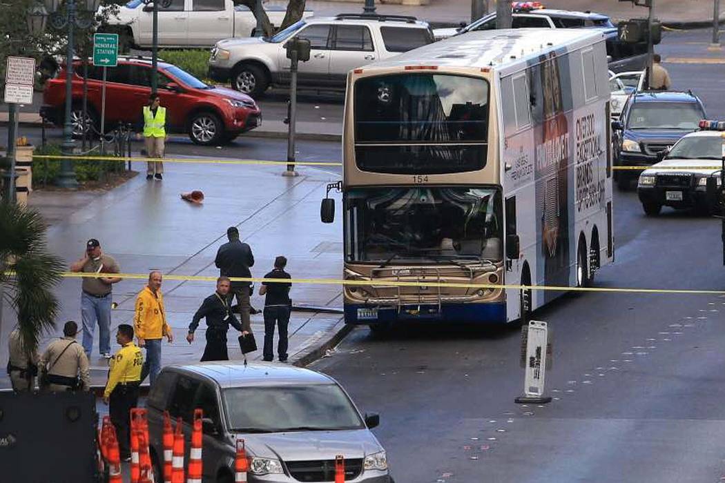 Police investigate the scene of a shooting on an RTC bus that left one person dead and one injured outside the Cosmopolitan, March 25, 2017. (Brett Le Blanc/Las Vegas Review-Journal) @bleblancphoto