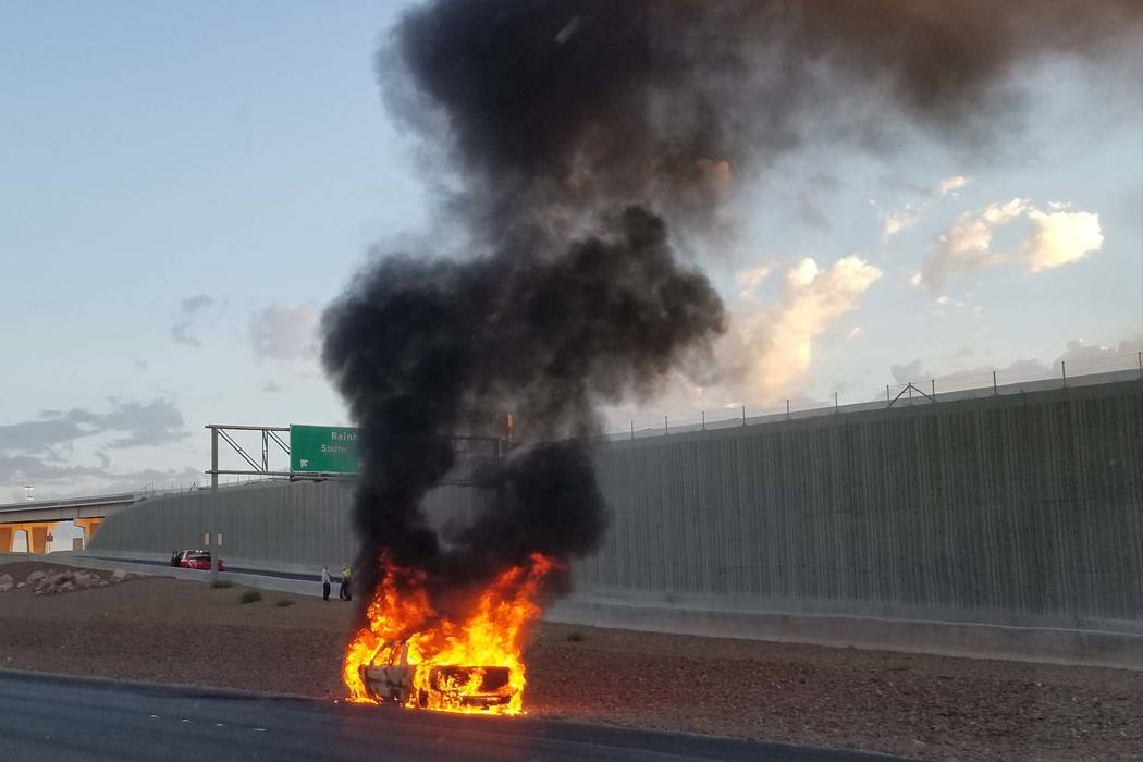 A vehicle caught on fire on U.S. Highway 95 near the Rainbow Boulevard exit on Friday, Aug. 11, 2017. (Patrick Connolly/Las Vegas Review-Journal)