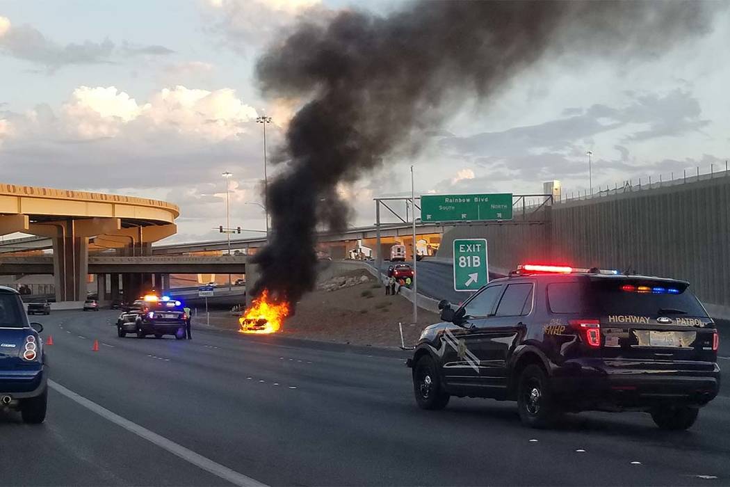 A vehicle fire Friday, Aug. 11, 2017, U.S. Highway 95 north near the Rainbow Boulevard exit has narrowed traffic down to one lane. (Patrick Connolly/Las Vegas Review-Journal)