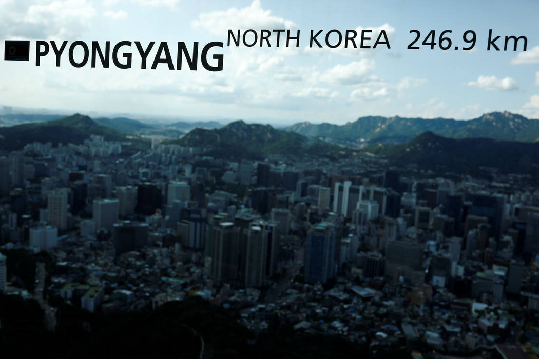 The central Seoul is seen through a window bearing the distance between Pyongyang and Seoul, at an observation platform in Seoul, South Korea, August 11, 2017. (Kim Hong-Ji/Reuters)