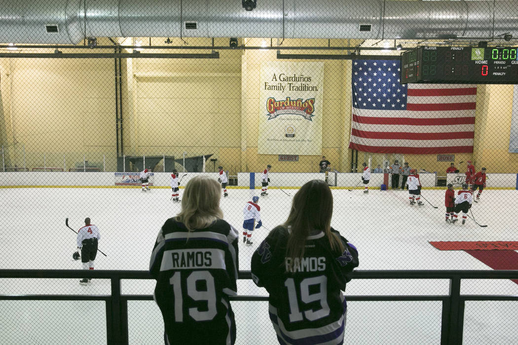 Fans of Danny Ramos, who plays for the Nevada Storm Youth Hockey team and played for the event's white team, watch teams warm up before the Fifth Annual Charity Ice Hockey game at the Sobe Ice Are ...