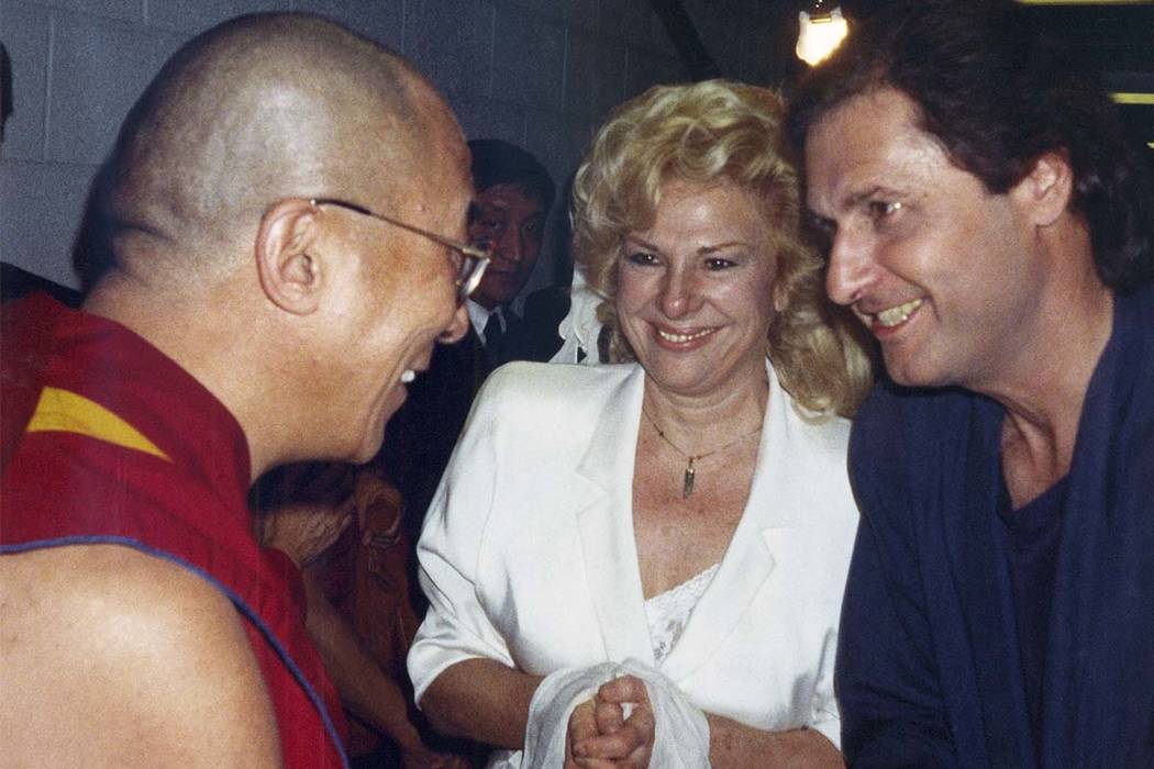 The Dalai Lama, left, talks to the comedy writing and acting team of Renee Taylor and Joe Bologna, during a backstage visit prior to the Dalai Lama's convocation on the subject of compassion at UC ...