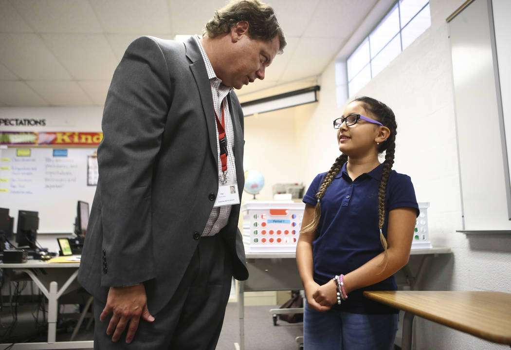 Seventh-grader Andrea Perez Lamas, 12, an English language learning student, talks with Clark County School District Superintendent Pat Skorkowsky during the first day of classes at Garside Junior ...