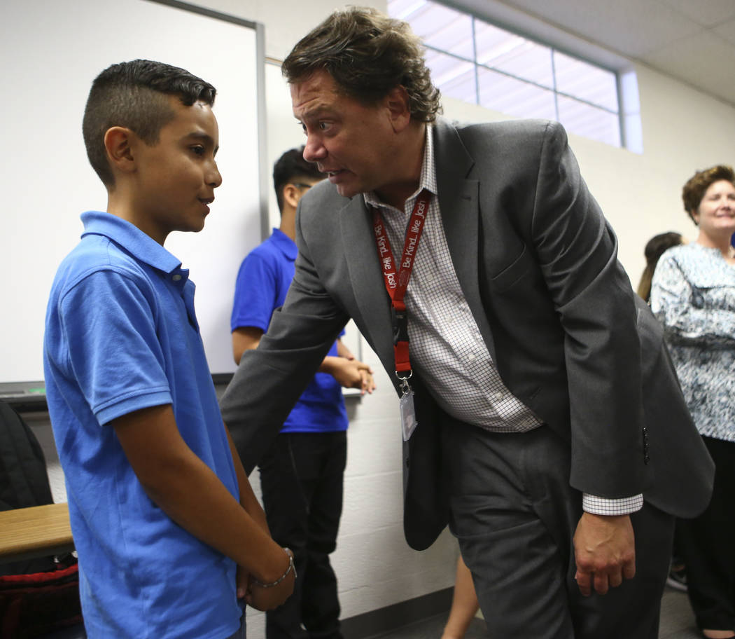 Eighth-grader Miguel Magana, 13, an English language learning student, talks with Clark County School District Superintendent Pat Skorkowsky during the first day of classes at Garside Junior High ...