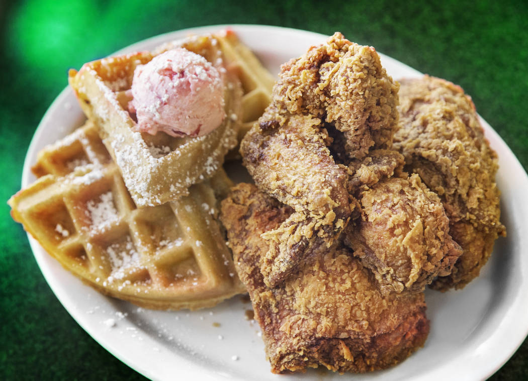 Fried chicken and waffle, with half a fried chicken and a Belgian waffle topped with strawberry butter and sweet and spicy sauce at Metro Diner on Friday, Aug 18, 2017, in Las Vegas. (Benjamin Hag ...