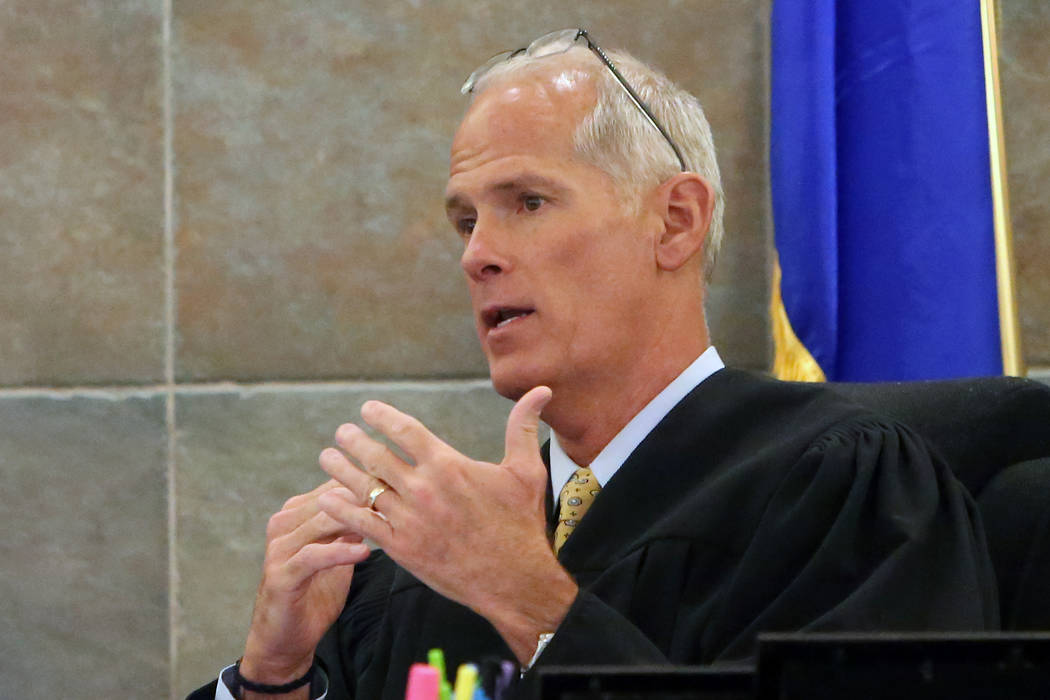 District Judge Douglas Herndon instructs a jury on May 2, 2017, at the Regional Justice Center. Last week, he gave three teen defendants some advice about the importance of making good decisions.  ...