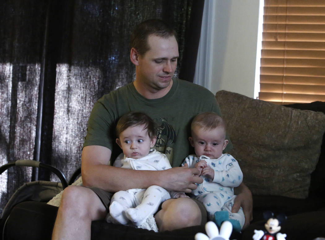 Andrew Lynch plays with his 5-month-old fraternal twin sons Benson, left, and Anakin at his Las Vegas home on Friday, Aug. 18, 2017. (Bizuayehu Tesfaye/Las Vegas Review-Journal) @bizutesfaye