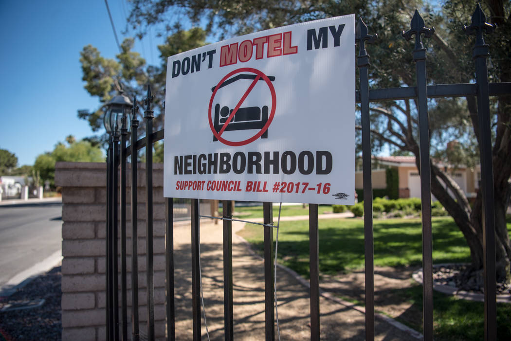 Shadow Lane exhibiting their "Don't Motel My Neighborhood" signs on Wednesday, June 14, 2017, in Las Vegas. Las Vegas is going live with a new fix for problematic party houses Tuesday, Aug. 15, 20 ...