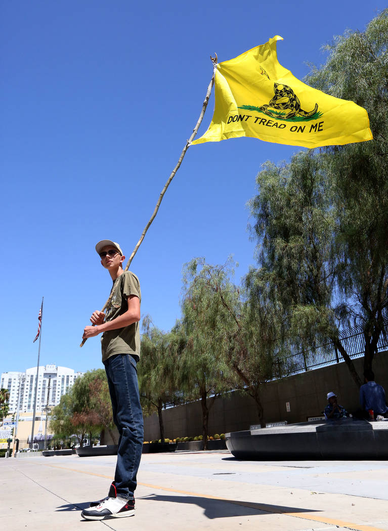 Kevin Baxter, 15, of North Las Vegas stands on the curb of Las Vegas Boulevard in front of the federal courthouse during the Bunkerville standoff retrial on Tuesday, Aug. 15, 2017. Michael Quine L ...