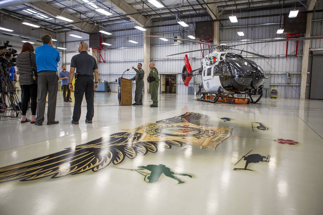 Media gather around the new Las Vegas Metropolitan Police helicopter at the North Las Vegas Airport on Wednesday, Aug. 16, 2017.  Patrick Connolly Las Vegas Review-Journal @PConnPie