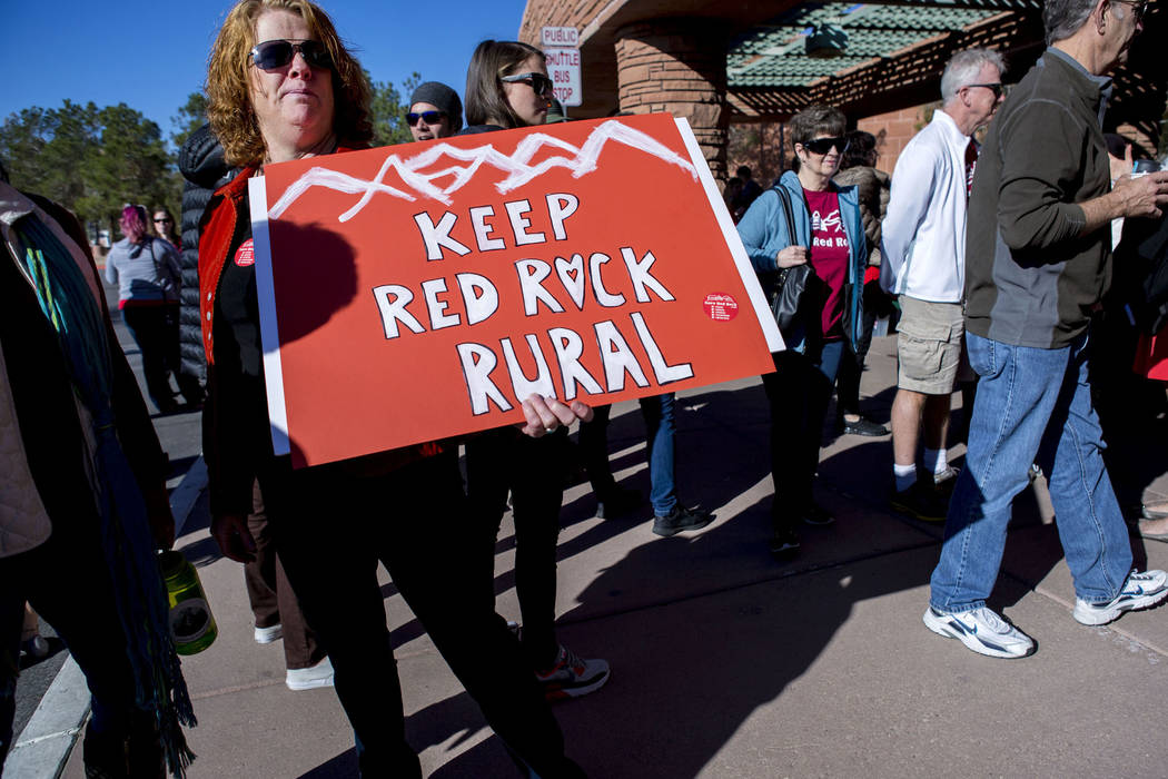 Susan Nicaise, a supporter of Save Red Rock, holds a sign to protest the proposed development of 5,025 homes on Blue Diamond Hill at a press conference before the county commissioners meeting, Wed ...