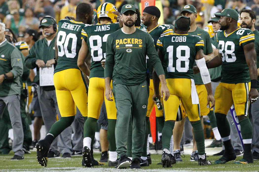 Green Bay Packers' Aaron Rodgers is seen on the sidelines during the first half of a preseason NFL football game against the Philadelphia Eagles Thursday, Aug. 10, 2017, in Green Bay, Wis. (AP Pho ...
