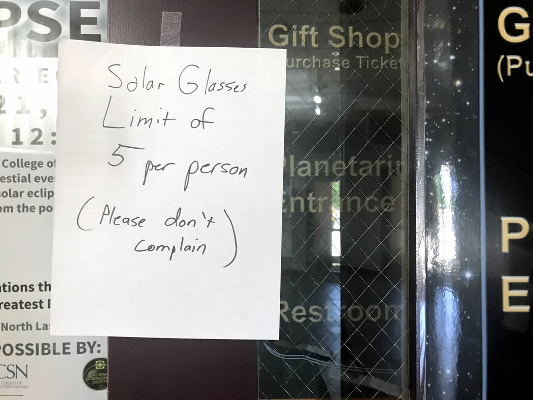 A sign hangs on the door of the College of Southern Nevada's Planetarium gift shop Thursday, Aug. 17, 2017, alerting customers to a buying limit for solar eclipse glasses. Jessie Bekker Las Vegas  ...
