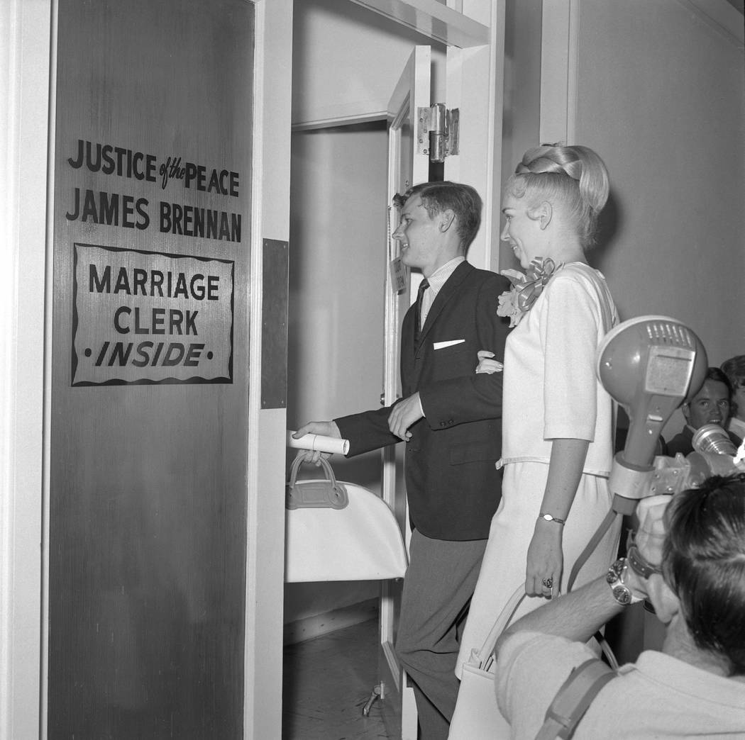 Couples rush to secure a marriage license and get married ahead of a military draft deadline, Aug. 25, 1965. (Milt Palmer/Las Vegas News Bureau)