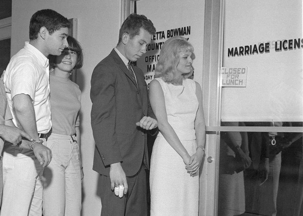 Couples rush to secure a marriage license and get married ahead of a military draft deadline, Aug. 25, 1965. (Milt Palmer/Las Vegas News Bureau)