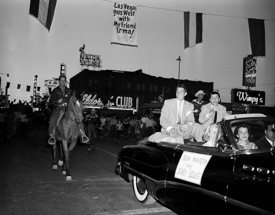 Dean Martin and Jerry Lewis ride down Main Street of Las Vegas on April 5, 1953, enroute to theatre for premiere of latest film. Parts of the picture were made in the gambling-resort city and a pa ...