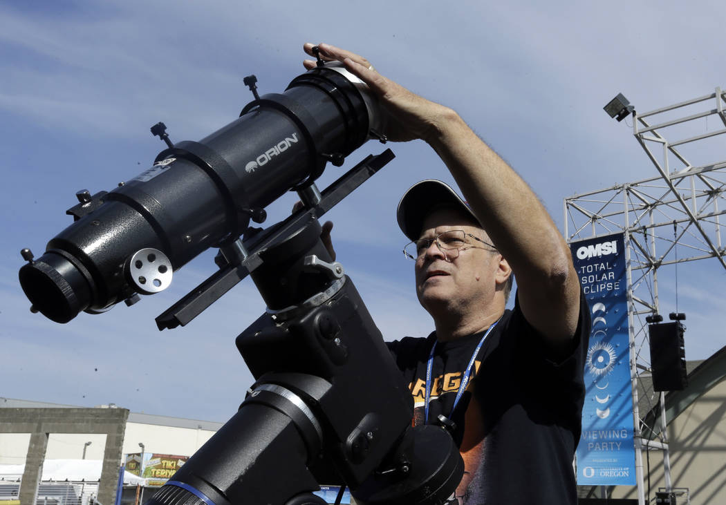 Ray Cooper, volunteer for the Oregon Museum of Science and Industry, preps his equipment to provide live video of the Aug. 21, 2017, solar eclipse at the state fairgrounds in Salem, Ore., Sunday, ...