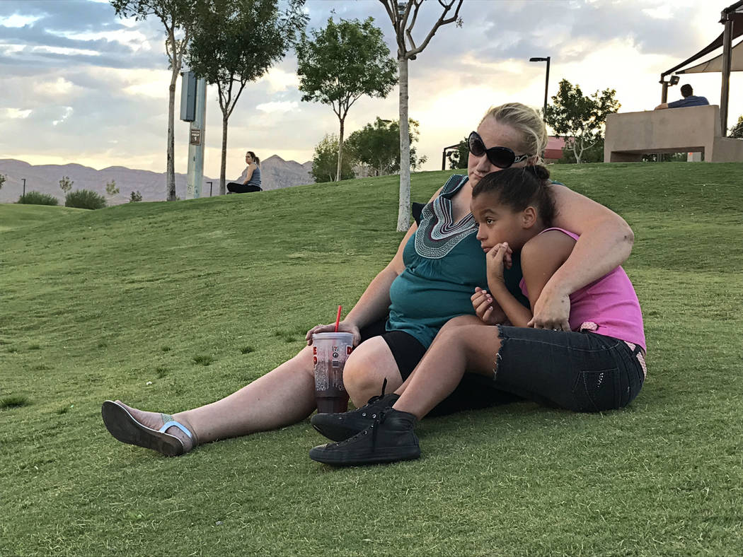 Trisha Charles, 41, left, consoles her 10-year-old daughter June at a balloon release honoring DaeVon Branon-Banks on Sunday, Aug. 20, 2017, in Las Vegas. Blake Apgar Review-Journal @blakeapgar